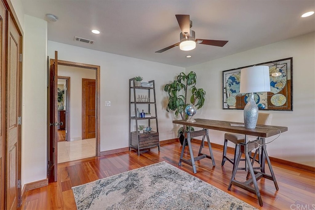 12392 Ranchview Drive Santa Ana, CA 92705 - Photo 27 of 72 a view of a dining room with furniture and wooden floor