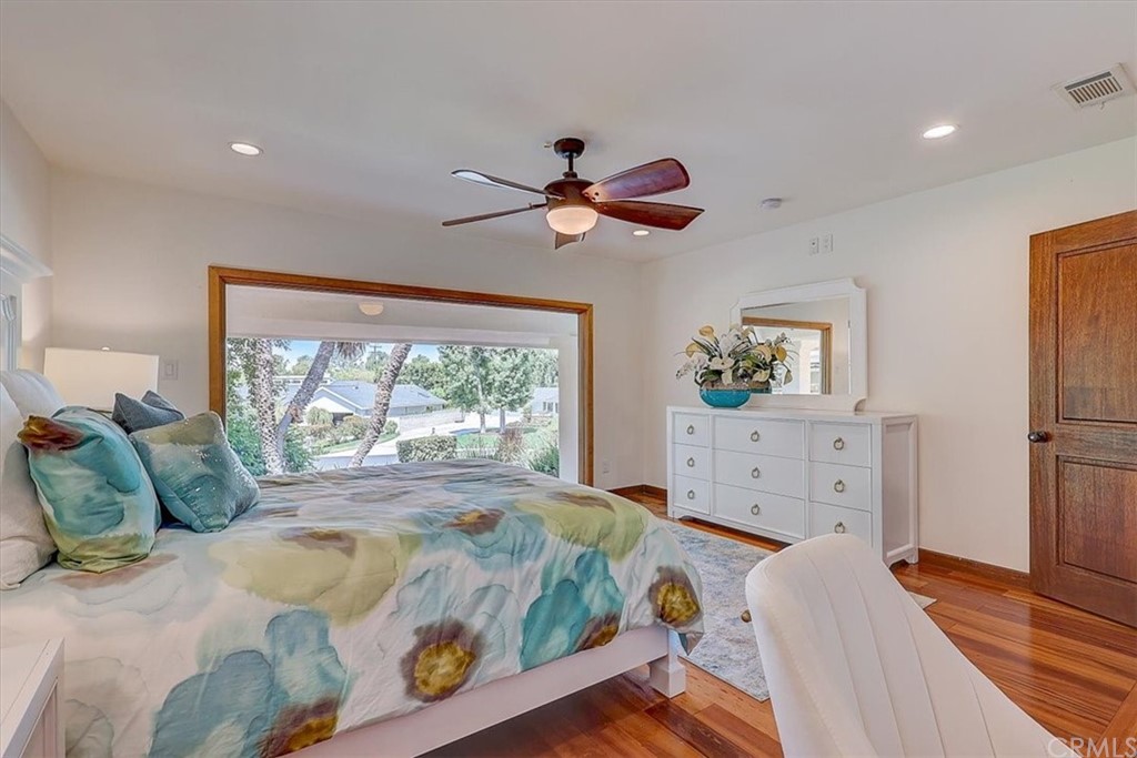 12392 Ranchview Drive Santa Ana, CA 92705 - Photo 44 of 72 a bedroom with a bed and wooden floor