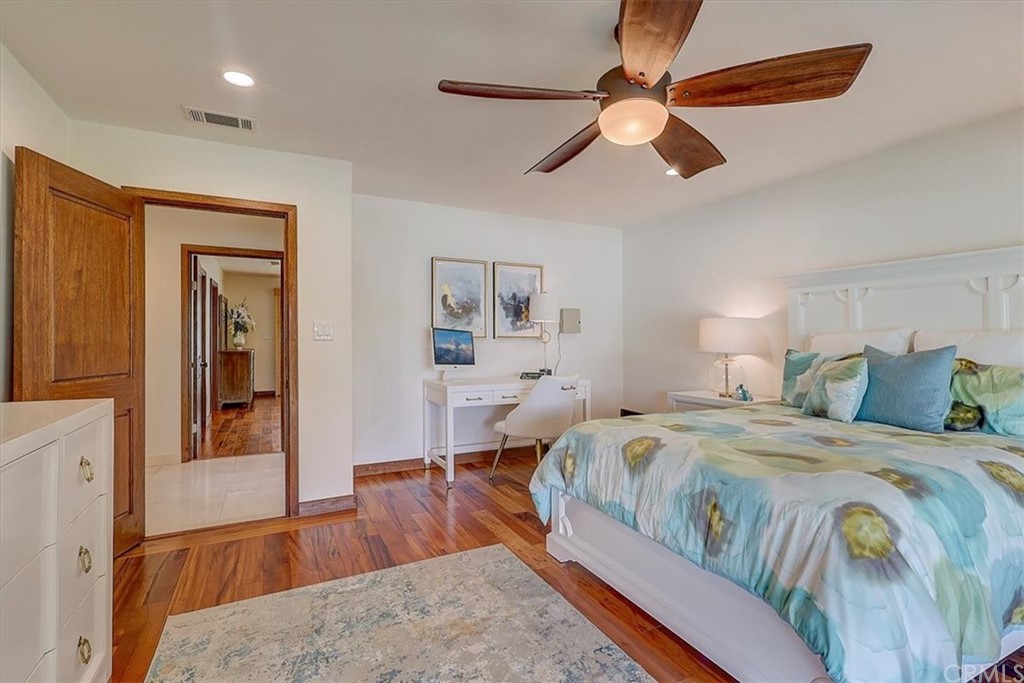 12392 Ranchview Drive Santa Ana, CA 92705 - Photo 45 of 72 a bedroom with a large bed and a chandelier