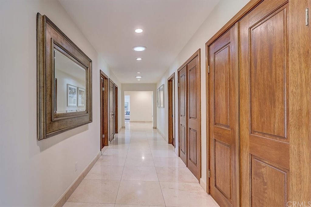 12392 Ranchview Drive Santa Ana, CA 92705 - Photo 46 of 72 a view of a hallway with wooden shelves