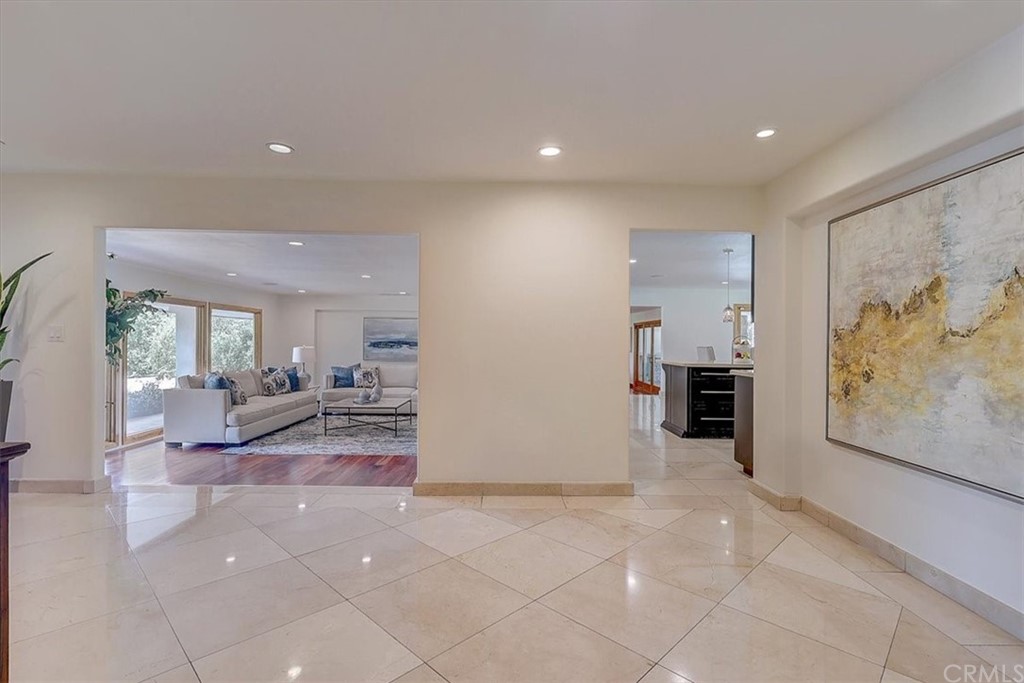 12392 Ranchview Drive Santa Ana, CA 92705 - Photo 47 of 72 a living room with furniture a rug and white walls