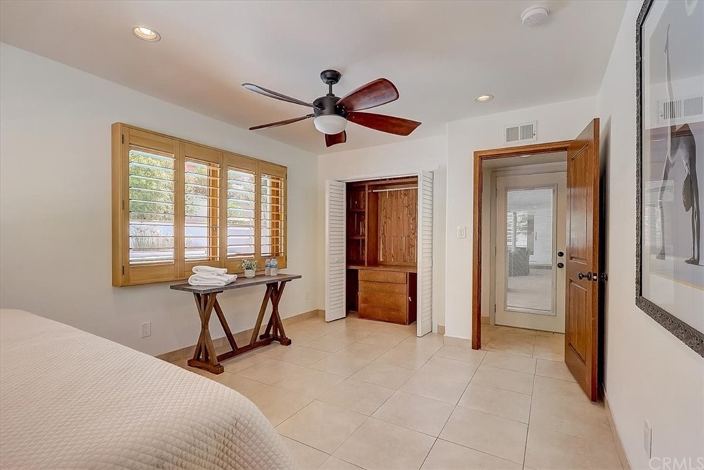 12392 Ranchview Drive Santa Ana, CA 92705 - Photo 50 of 72 a bedroom with furniture and a window