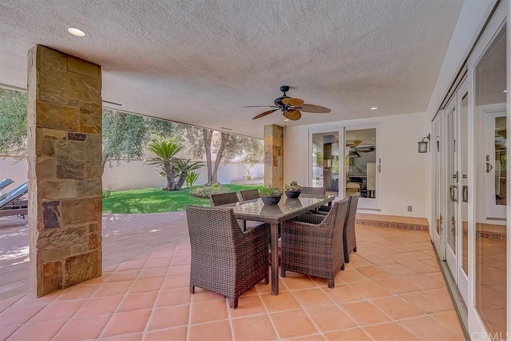 12392 Ranchview Drive Santa Ana, CA 92705 - Photo 55 of 72 a view of a patio with a dining table and chairs