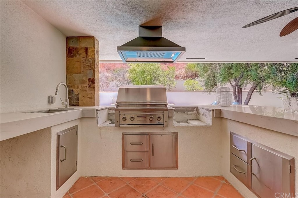 12392 Ranchview Drive Santa Ana, CA 92705 - Photo 56 of 72 a kitchen with stainless steel appliances granite countertop a stove a sink and a microwave
