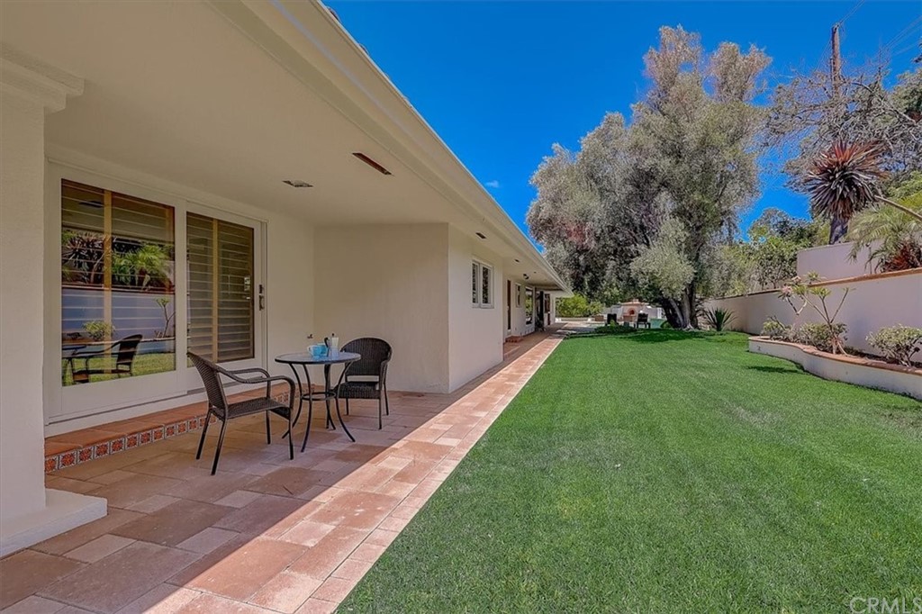 12392 Ranchview Drive Santa Ana, CA 92705 - Photo 67 of 72 a view of a house with backyard sitting area and garden