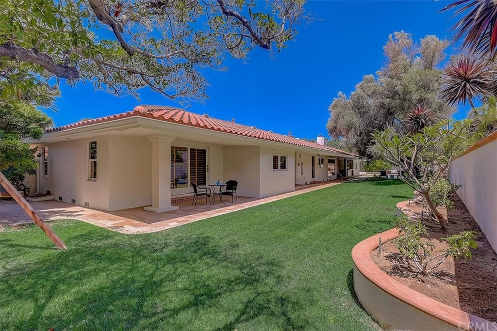 12392 Ranchview Drive Santa Ana, CA 92705 - Photo 69 of 72 a view of a house with backyard sitting area and garden