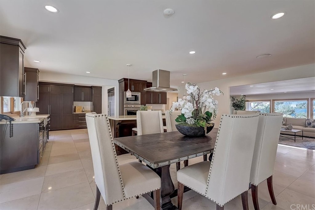 12392 Ranchview Drive Santa Ana, CA 92705 - Photo 10 of 72 a view of a dining room with furniture and wooden floor