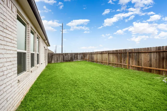 an aerial view of a house with a garden
