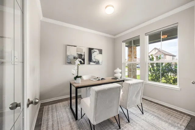 a dining room with furniture and window