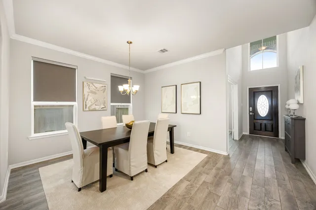 a view of a livingroom with furniture window and wooden floor