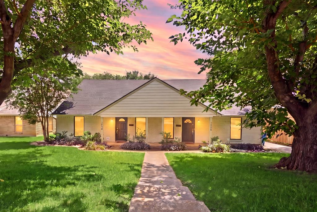 7354 Walling Lane Dallas, TX 75231 - Photo 1 of 28 a front view of a house with yard