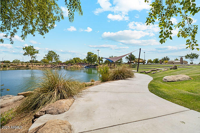 8459 West Gehrig Way Florence, AZ 85132 - Photo 20 of 37 a view of a lake with houses in the back