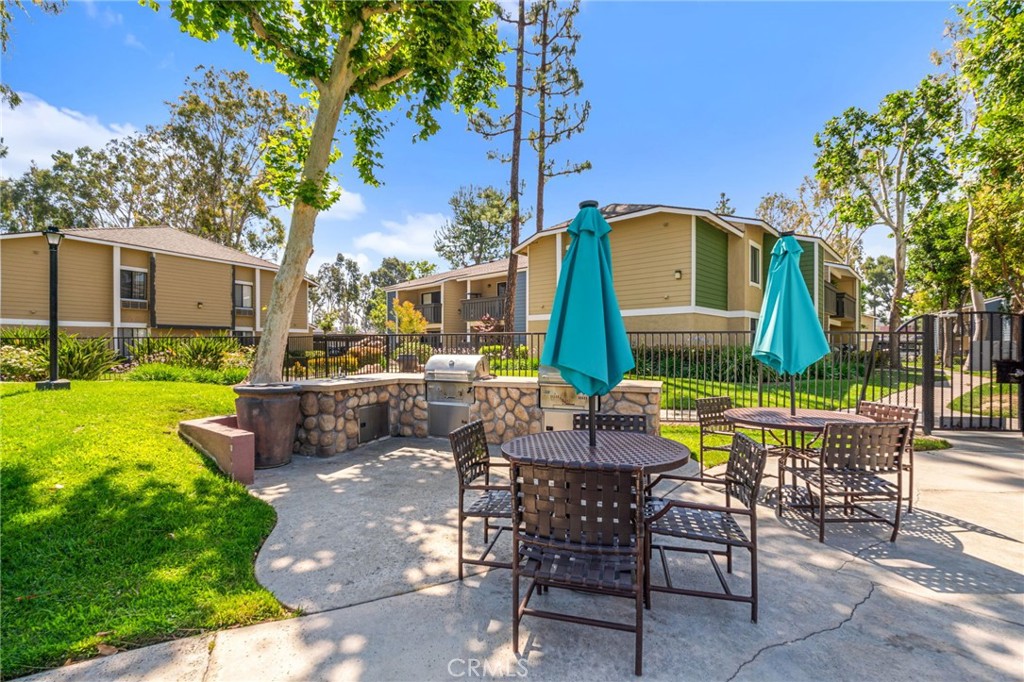 3535 Banbury Drive, Unit 119 Riverside, CA 92505 - Photo 20 of 23 a view of a chairs and table in backyard of the house