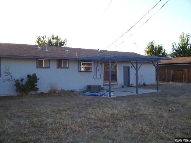 3965 Peregrine Circle Reno, NV 89508 - Photo 2 of 2 a front view of a house with a garden