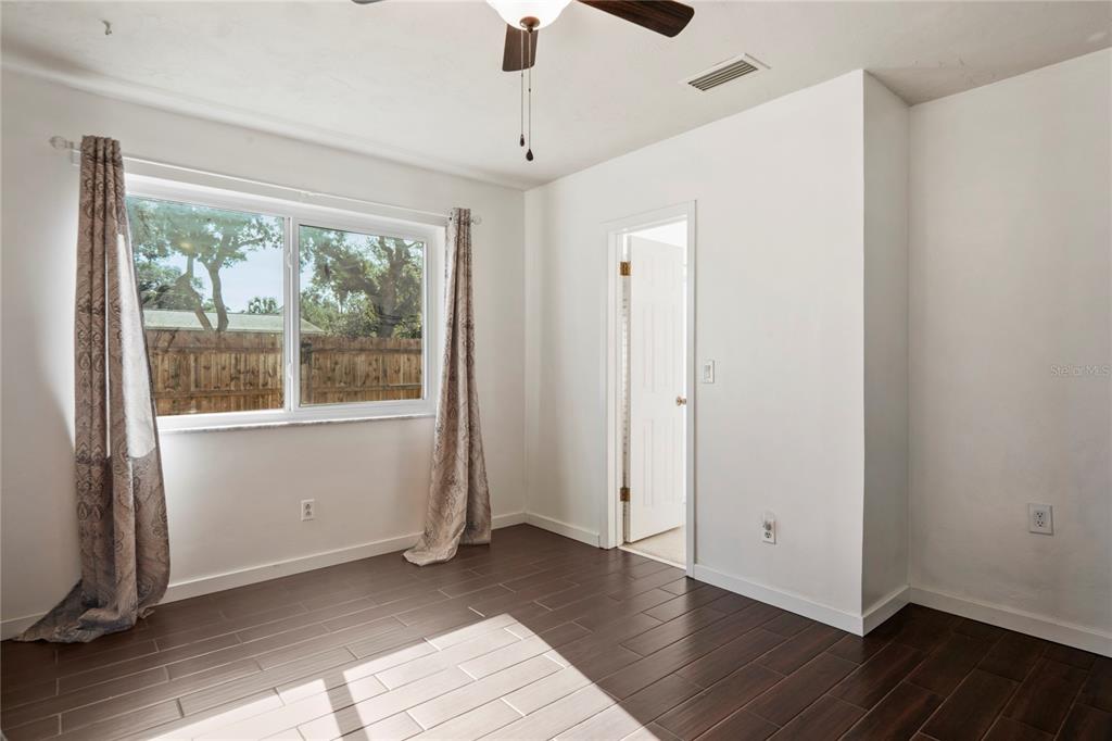 1282 Palm Street Clearwater, FL 33755 - Photo 16 of 55 wooden floor in an empty room with a window