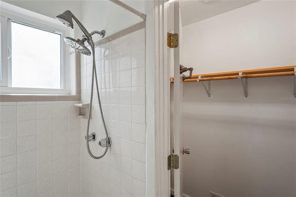 1282 Palm Street Clearwater, FL 33755 - Photo 20 of 55 a bathroom with a shower and a window