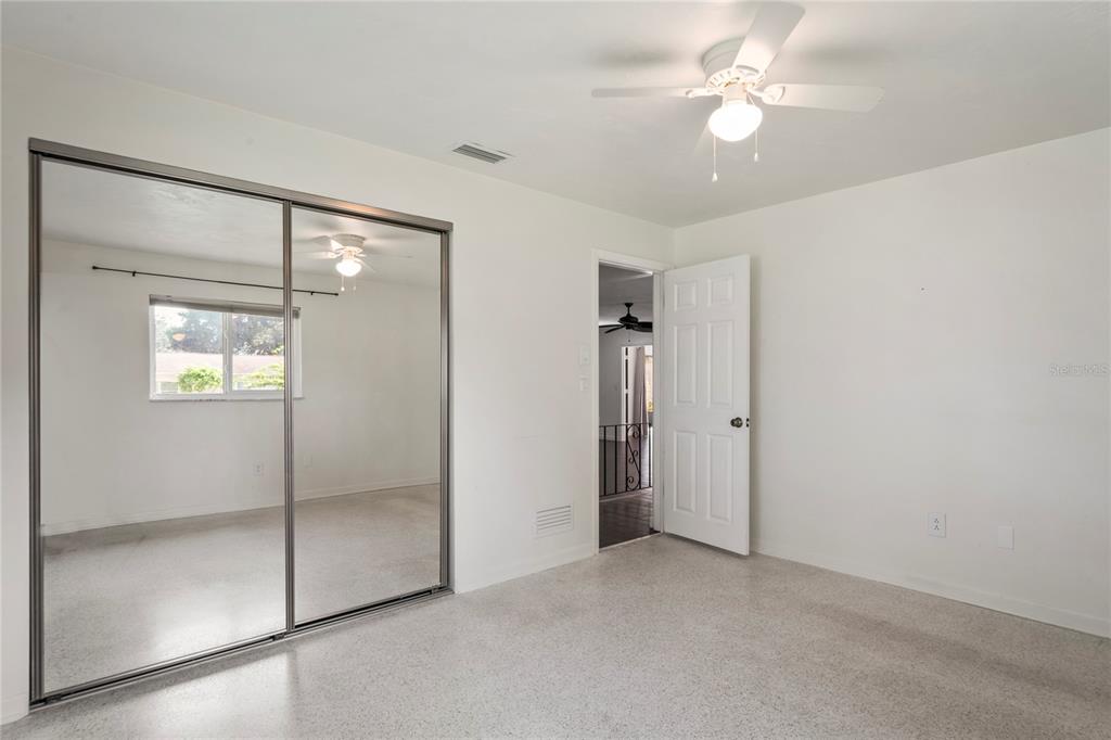 1282 Palm Street Clearwater, FL 33755 - Photo 22 of 55 a view of an empty room with a fan