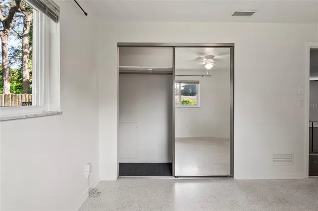 a view of an empty room with a window