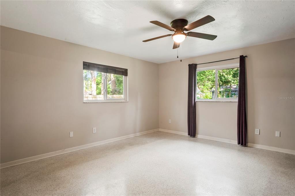 1282 Palm Street Clearwater, FL 33755 - Photo 26 of 55 an empty room with windows and fan