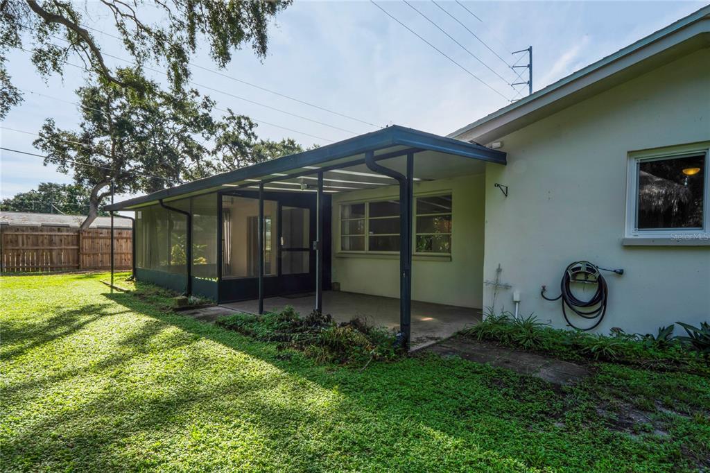 1282 Palm Street Clearwater, FL 33755 - Photo 33 of 55 a view of a house with backyard and a tree