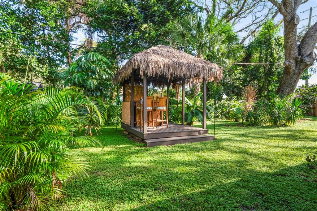 1282 Palm Street Clearwater, FL 33755 - Photo 36 of 55 a view of a table and chairs under an umbrella