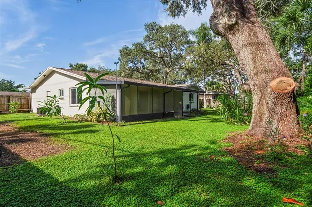 a view of a house with a backyard