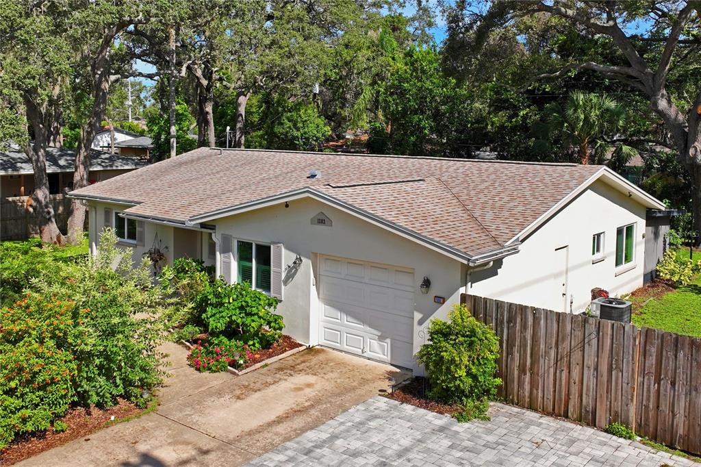 1282 Palm Street Clearwater, FL 33755 - Photo 55 of 55 a view of a house with a yard plants and large tree