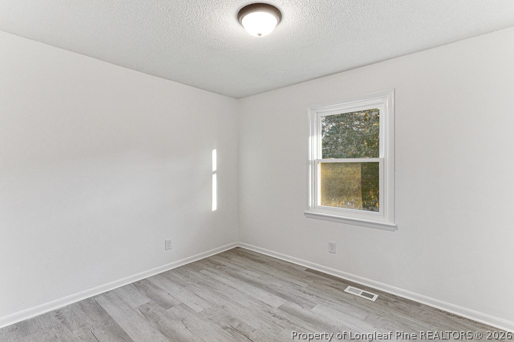 922 Rancho Drive Fayetteville, NC 28303 - Photo 14 of 21 an empty room with a window