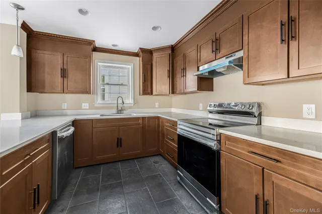 a kitchen with a sink stove and cabinets