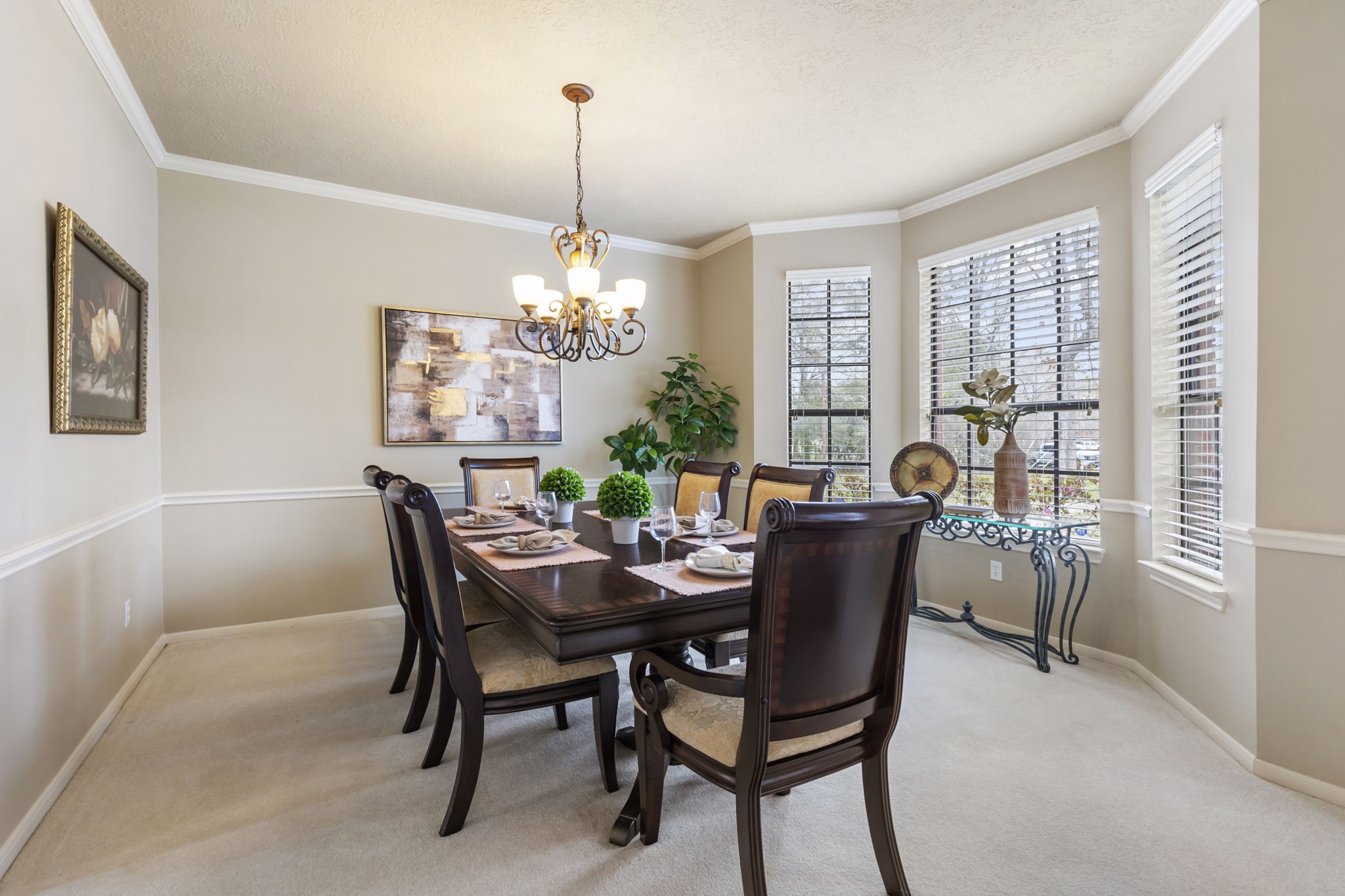 39327 Lago Drive Magnolia, TX 77354 - Photo 12 of 39 A dining room that effortlessly balances versatility and charm—spacious enough to host memorable family gatherings, yet perfectly cozy for an intimate candlelit dinner for two on those special occasions.