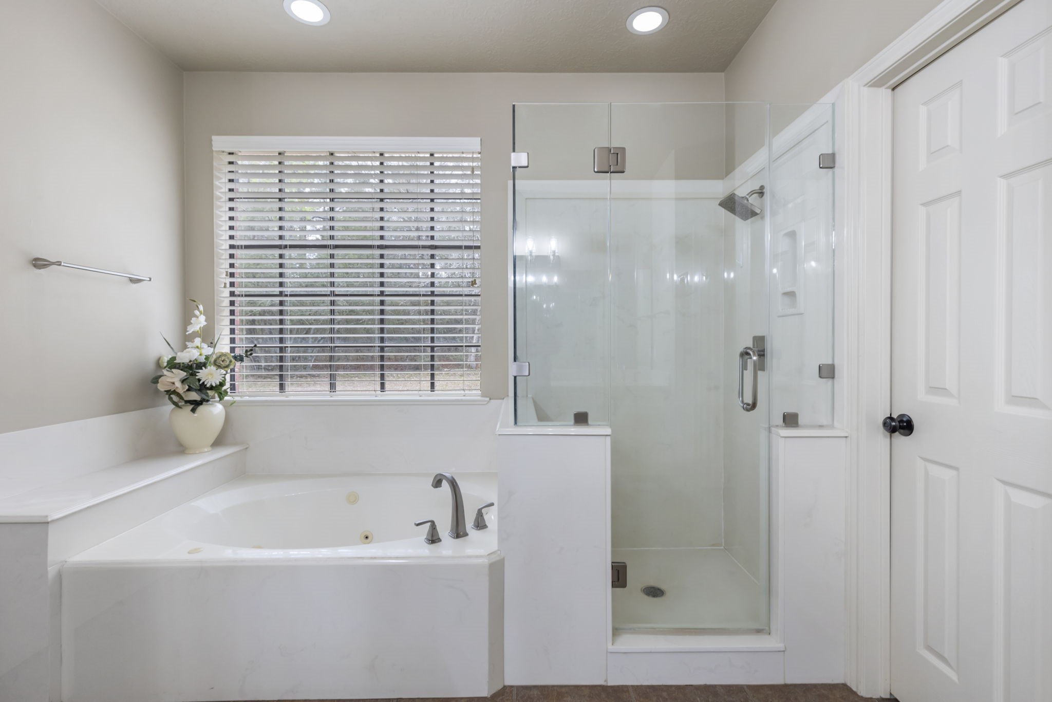 39327 Lago Drive Magnolia, TX 77354 - Photo 20 of 39 Or, sink into the inviting jetted tub, where you can soak away the stresses of the day in pure relaxation. Thoughtfully designed with style and serenity in mind, this space is your very own personal oasis—a haven you'll look forward to coming home to.