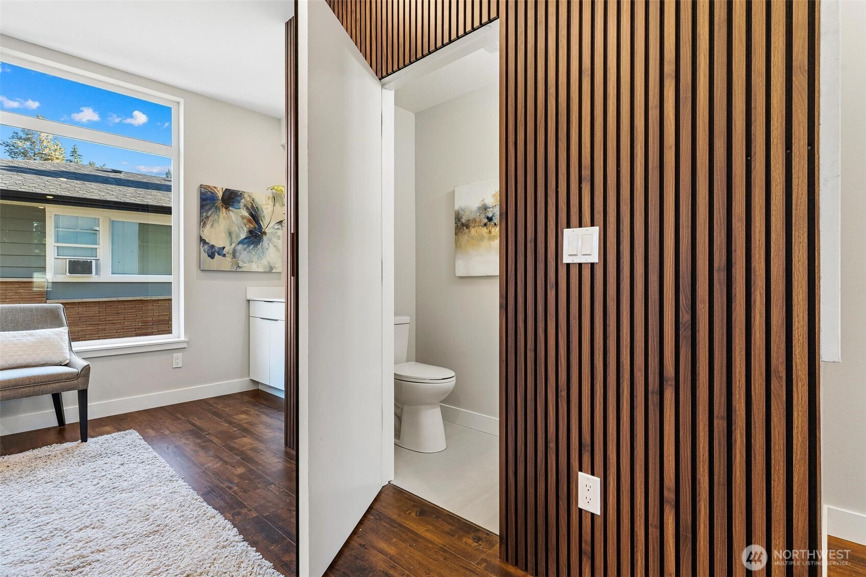 7146 47th Avenue Southwest Seattle, WA 98136 - Photo 11 of 34 a view of a hallway with wooden floor and a bathroom