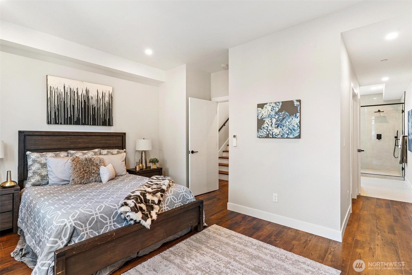 7146 47th Avenue Southwest Seattle, WA 98136 - Photo 14 of 34 a bedroom with a large bed and a couch