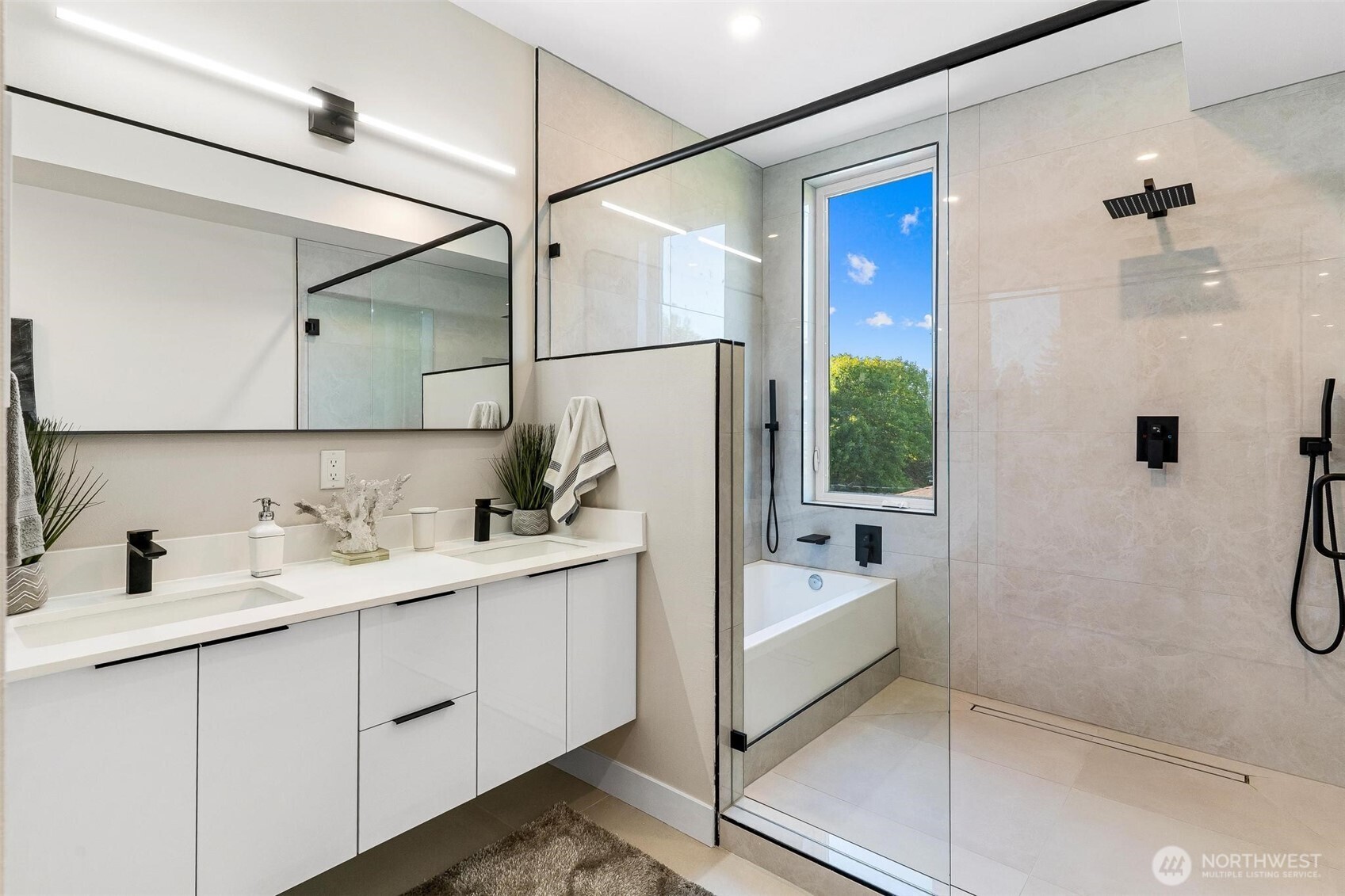 7146 47th Avenue Southwest Seattle, WA 98136 - Photo 17 of 34 a bathroom with a double vanity sink a mirror and a shower