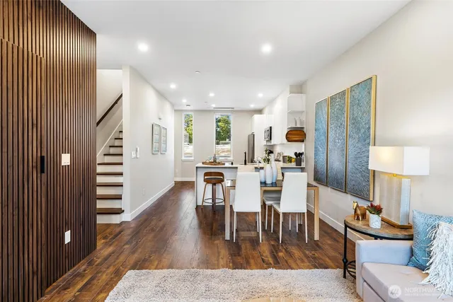 a view of a dining room with furniture and wooden floor