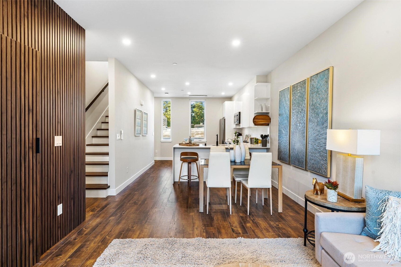 7146 47th Avenue Southwest Seattle, WA 98136 - Photo 3 of 34 a view of a dining room with furniture and wooden floor
