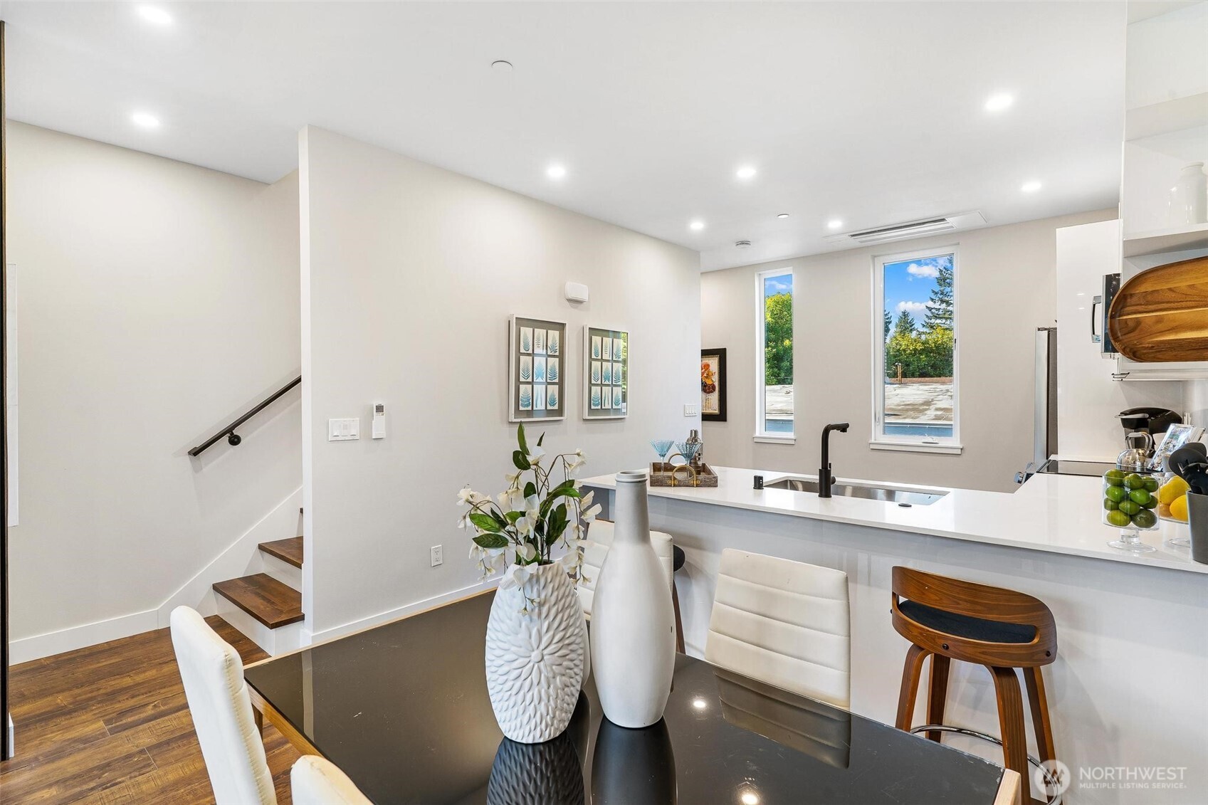 7146 47th Avenue Southwest Seattle, WA 98136 - Photo 9 of 34 a dining room with furniture and a kitchen view