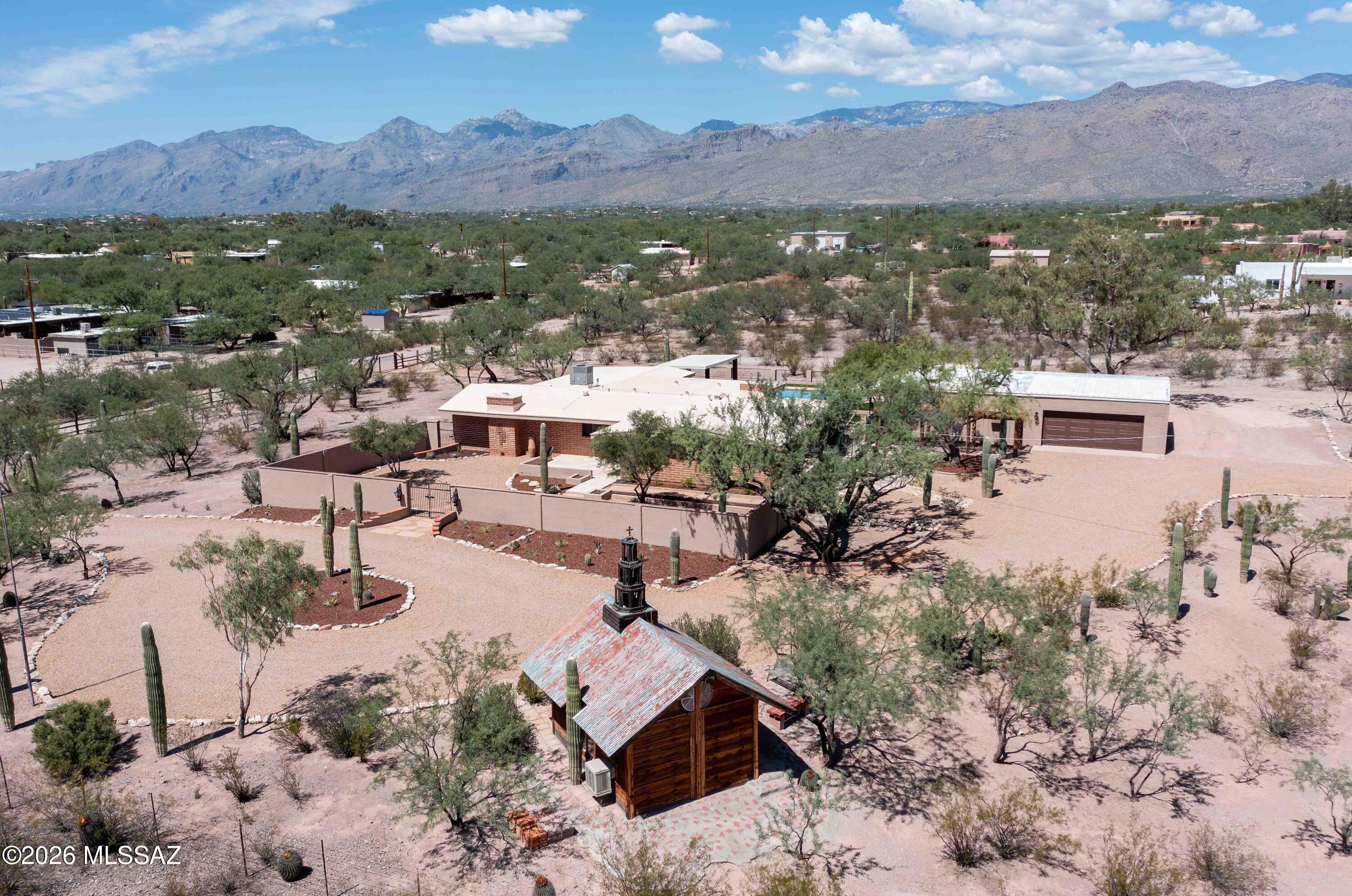 11525 East Tanque Verde Road Tucson, AZ 85749 - Photo 43 of 51 An aerial showing the unique on-site chapel, main residence, detached garage, and full Catalina Mountain views.