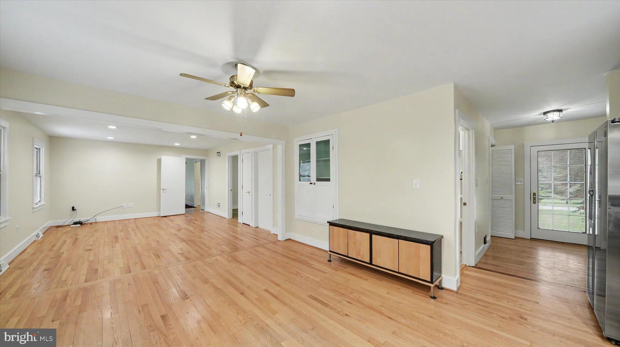 4037 Grande View Drive Pylesville, MD 21132 - Photo 19 of 74 a view of a livingroom with a hardwood floor and a ceiling fan