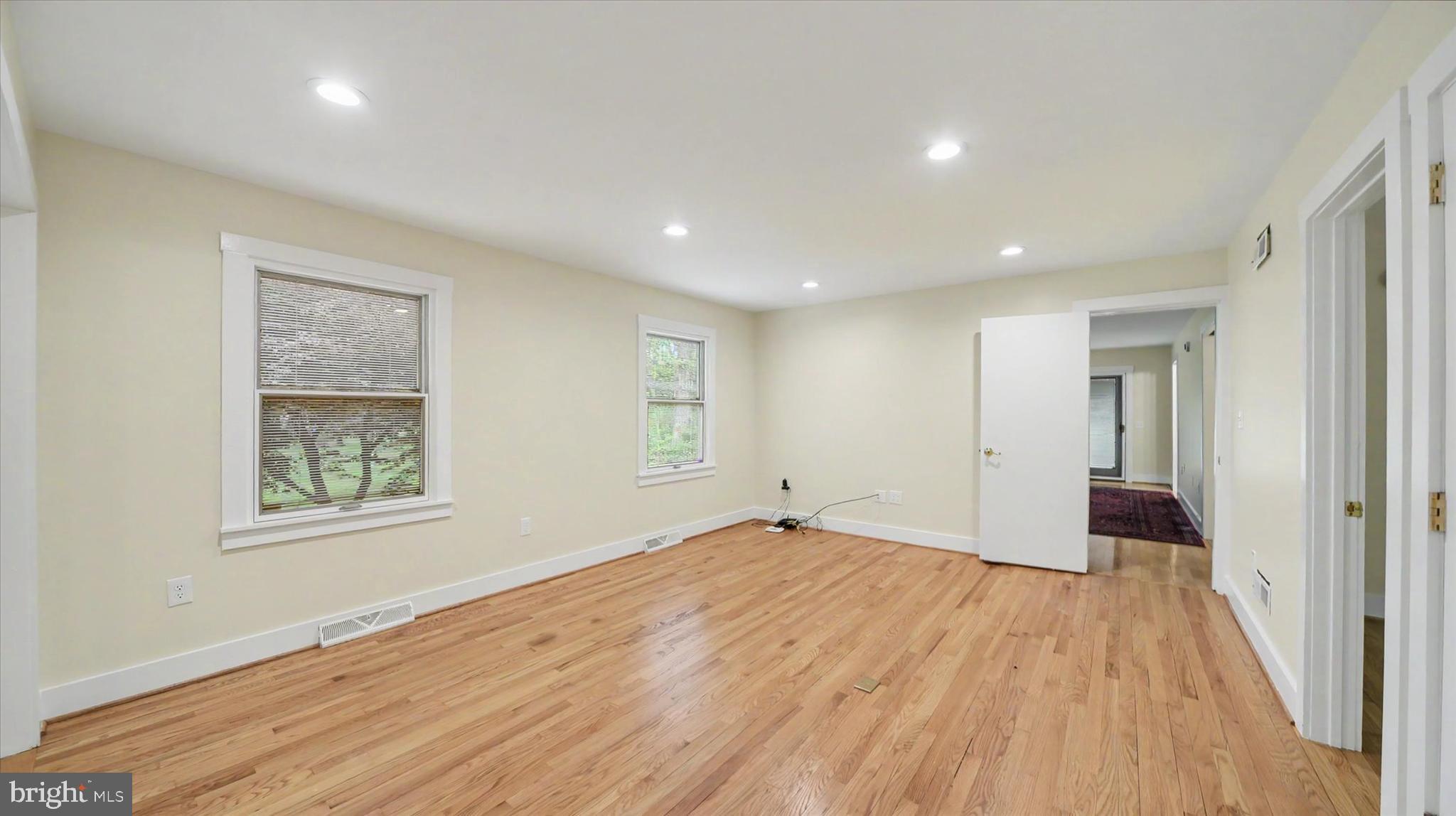 4037 Grande View Drive Pylesville, MD 21132 - Photo 20 of 74 a view of a big room with wooden floor and windows