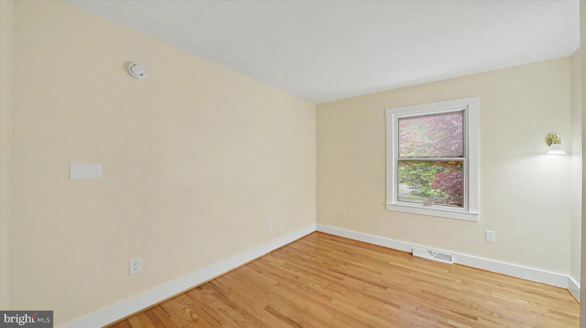 4037 Grande View Drive Pylesville, MD 21132 - Photo 24 of 74 a view of an empty room with wooden floor and a window