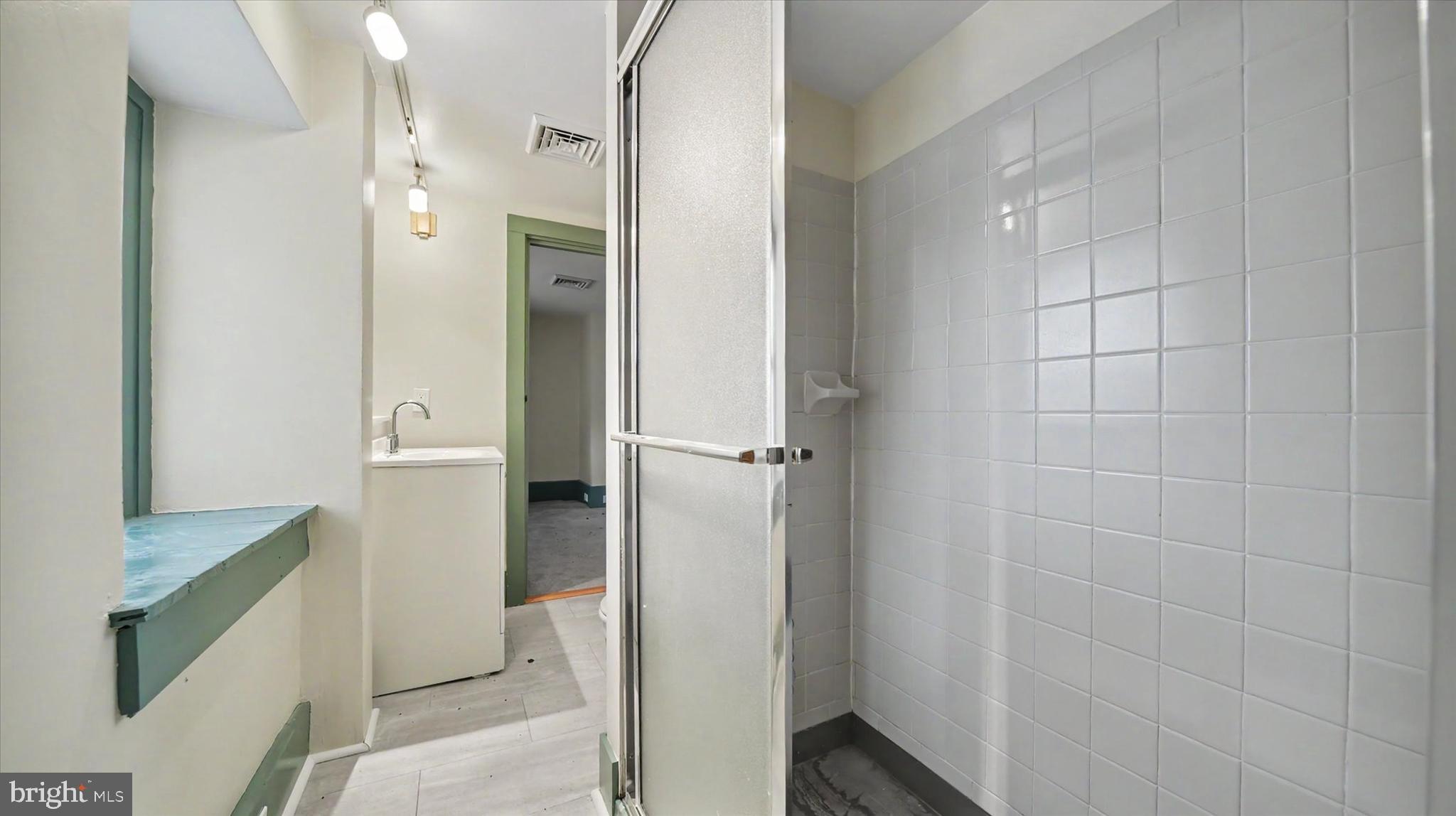 4037 Grande View Drive Pylesville, MD 21132 - Photo 36 of 74 a bathroom with a shower and a glass door