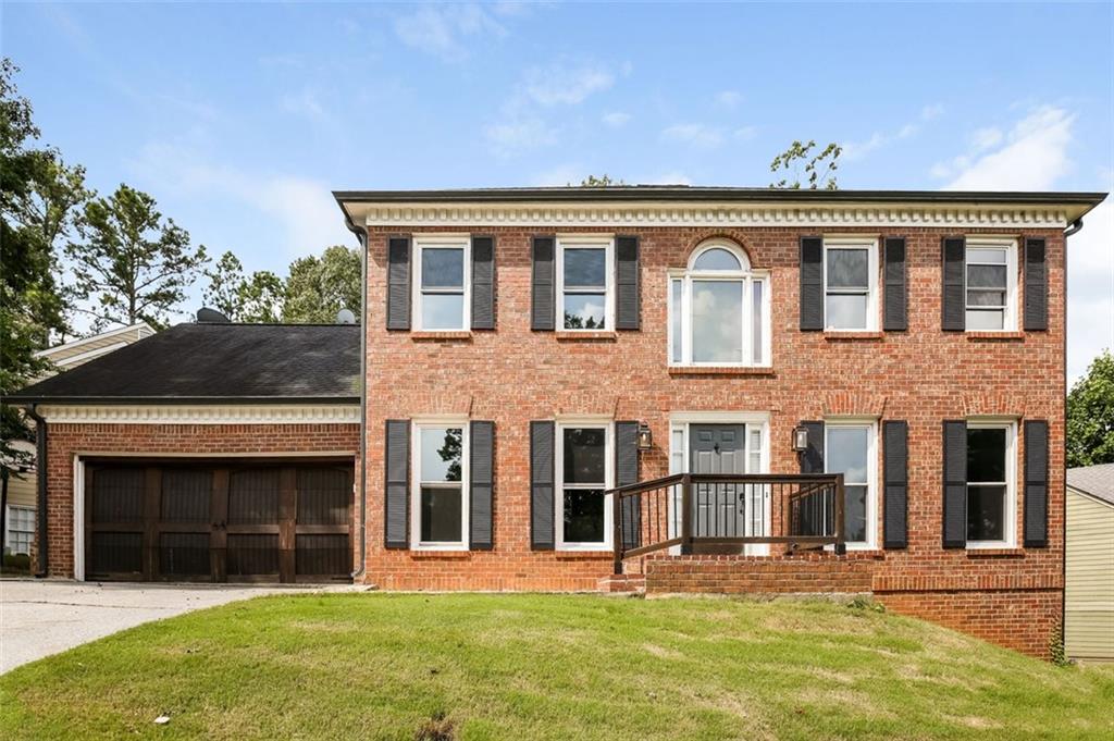 4803 Morning Chase Northwest Acworth, GA 30102 - Photo 1 of 1 a front view of a house with a yard and garage