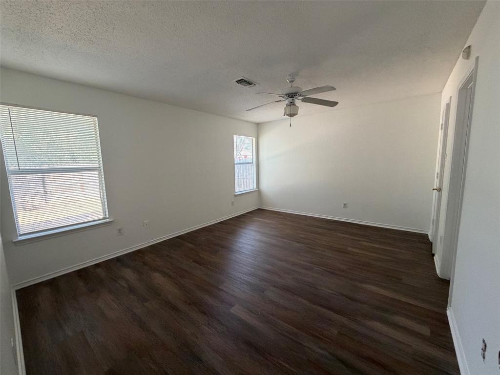 7116 Nohl Ranch Road Fort Worth, TX 76133 - Photo 5 of 10 Large master bedroom with ceiling fan and walk in closet