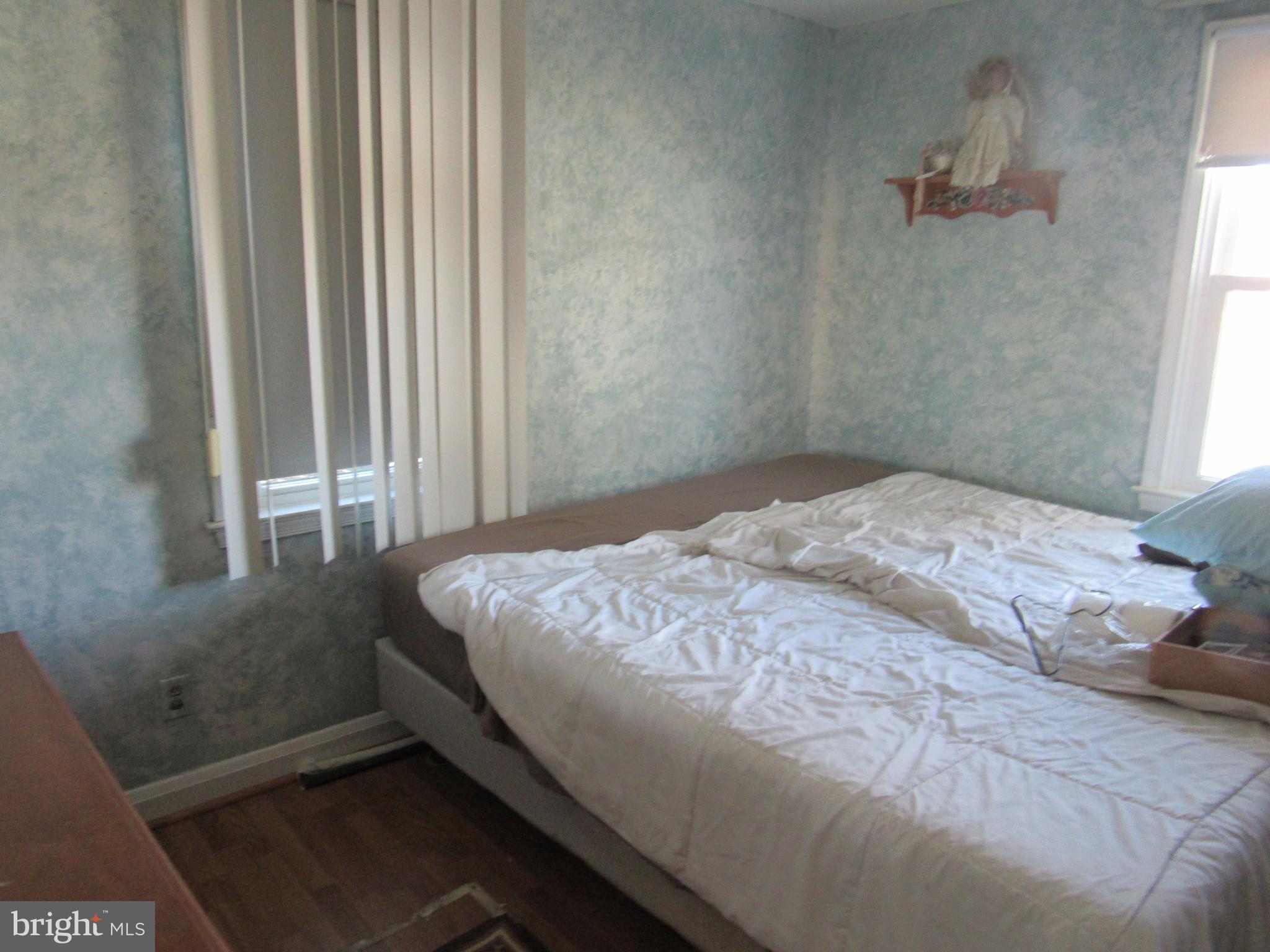 6301 Fieldvale Road Baltimore, MD 21237 - Photo 11 of 28 a bedroom with a bed and a window