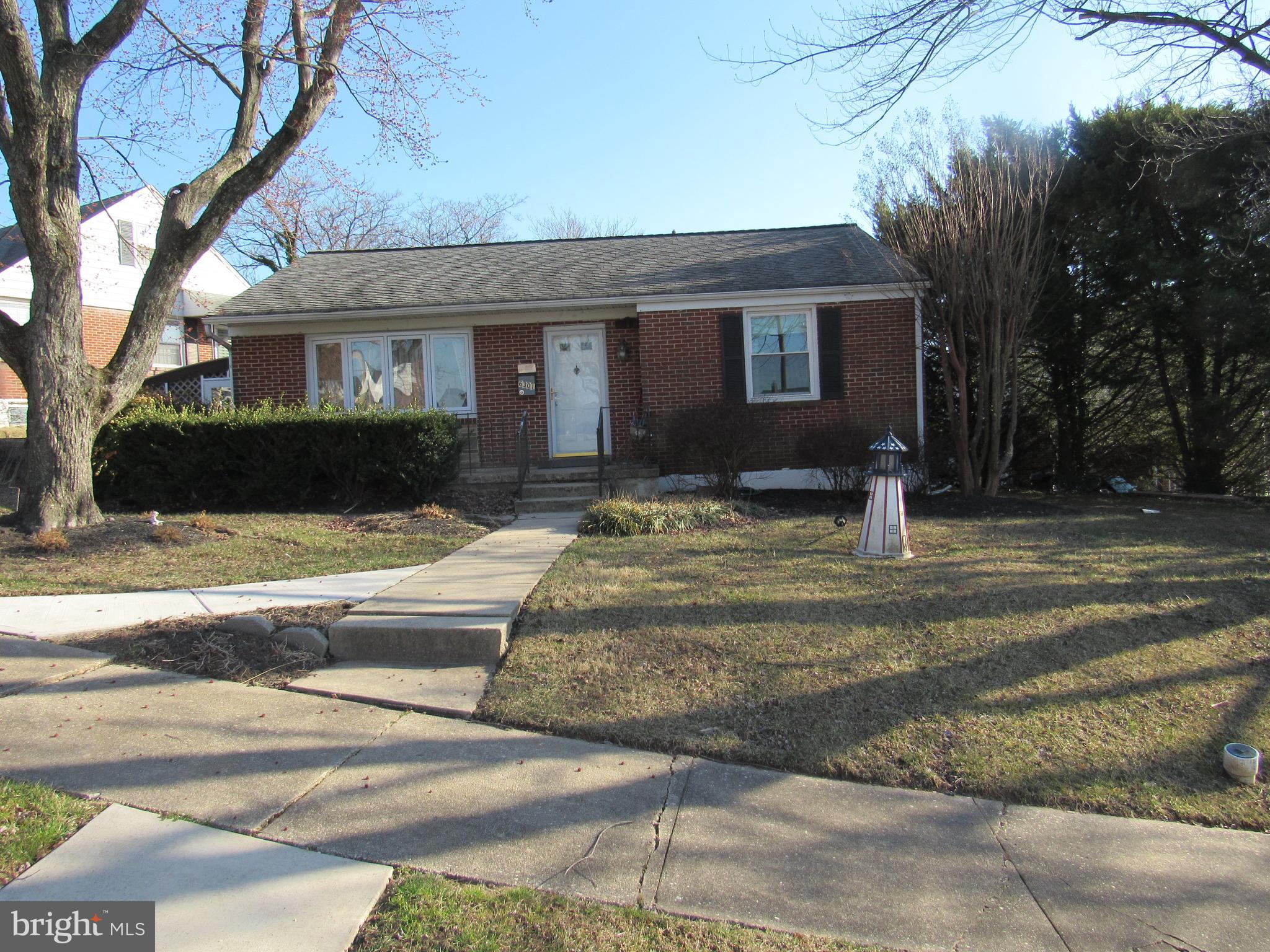 6301 Fieldvale Road Baltimore, MD 21237 - Photo 12 of 28 a front view of a house with a yard