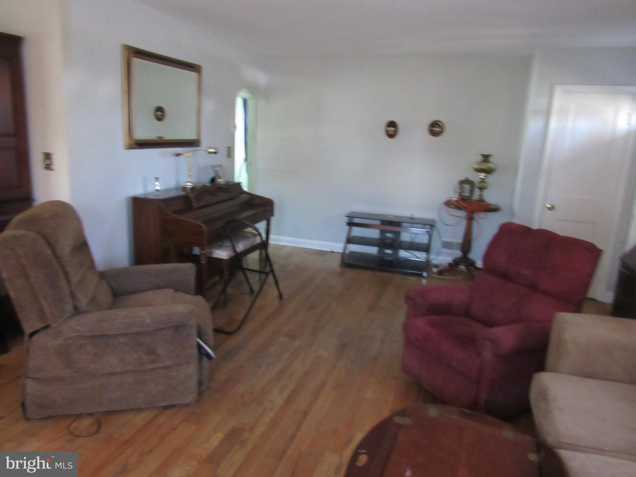6301 Fieldvale Road Baltimore, MD 21237 - Photo 14 of 28 a living room with furniture and a wooden floor