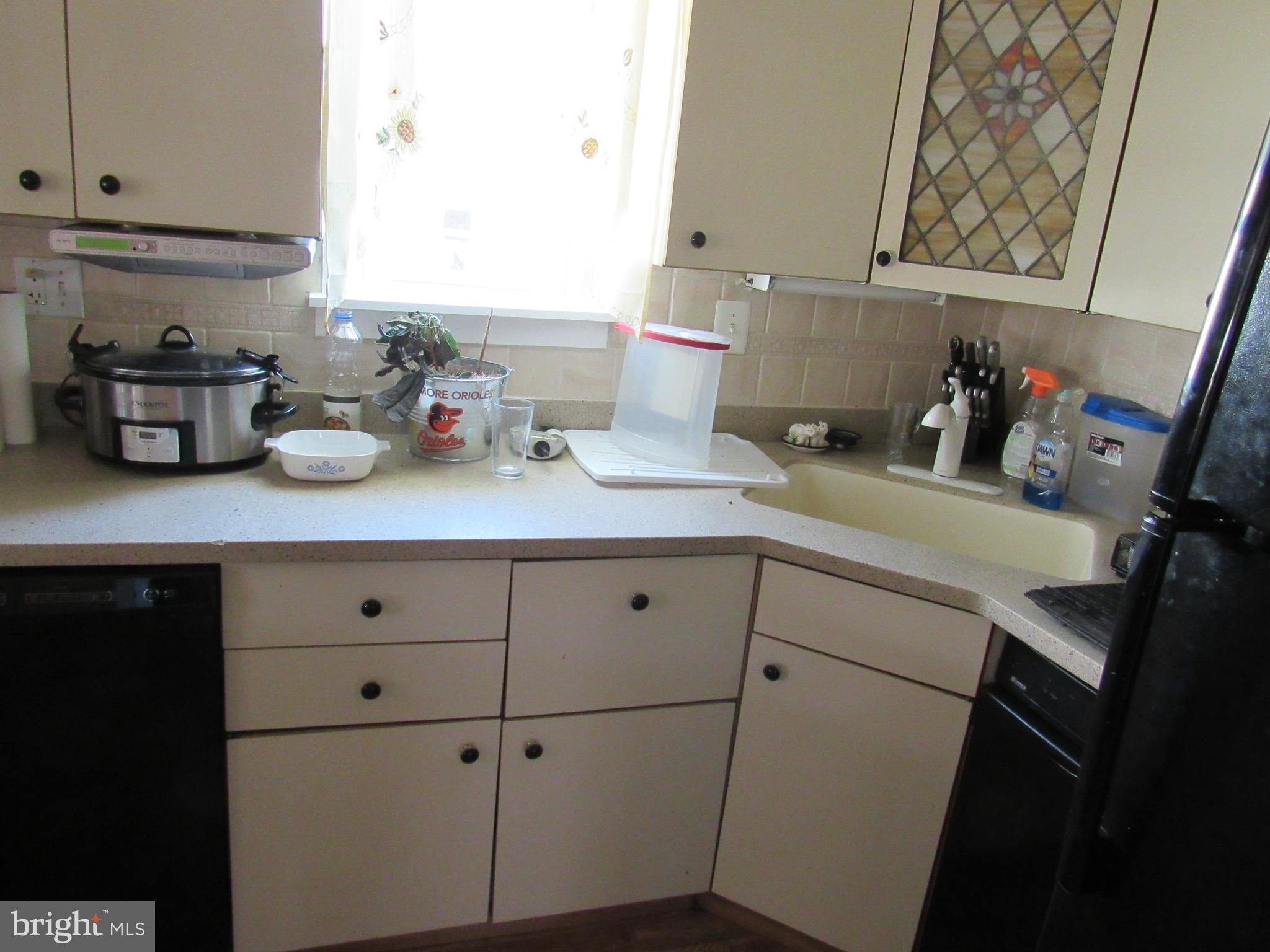 6301 Fieldvale Road Baltimore, MD 21237 - Photo 16 of 28 a kitchen with a sink and cabinets