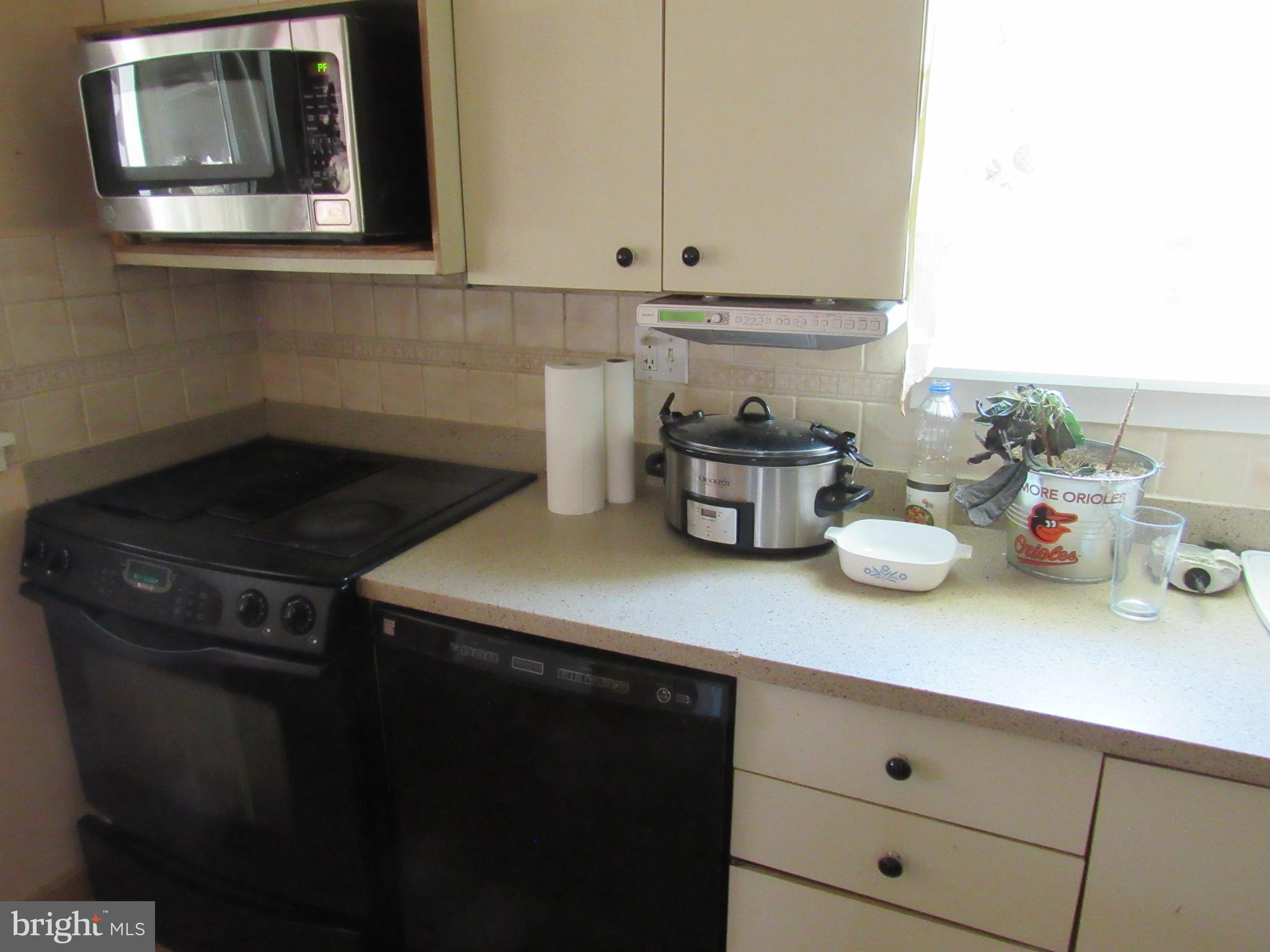 6301 Fieldvale Road Baltimore, MD 21237 - Photo 17 of 28 a kitchen with a sink and cabinets