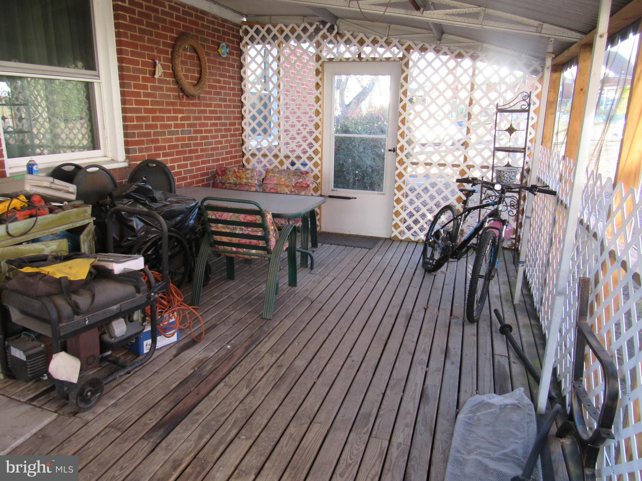 6301 Fieldvale Road Baltimore, MD 21237 - Photo 18 of 28 a living room with furniture and a floor to ceiling window